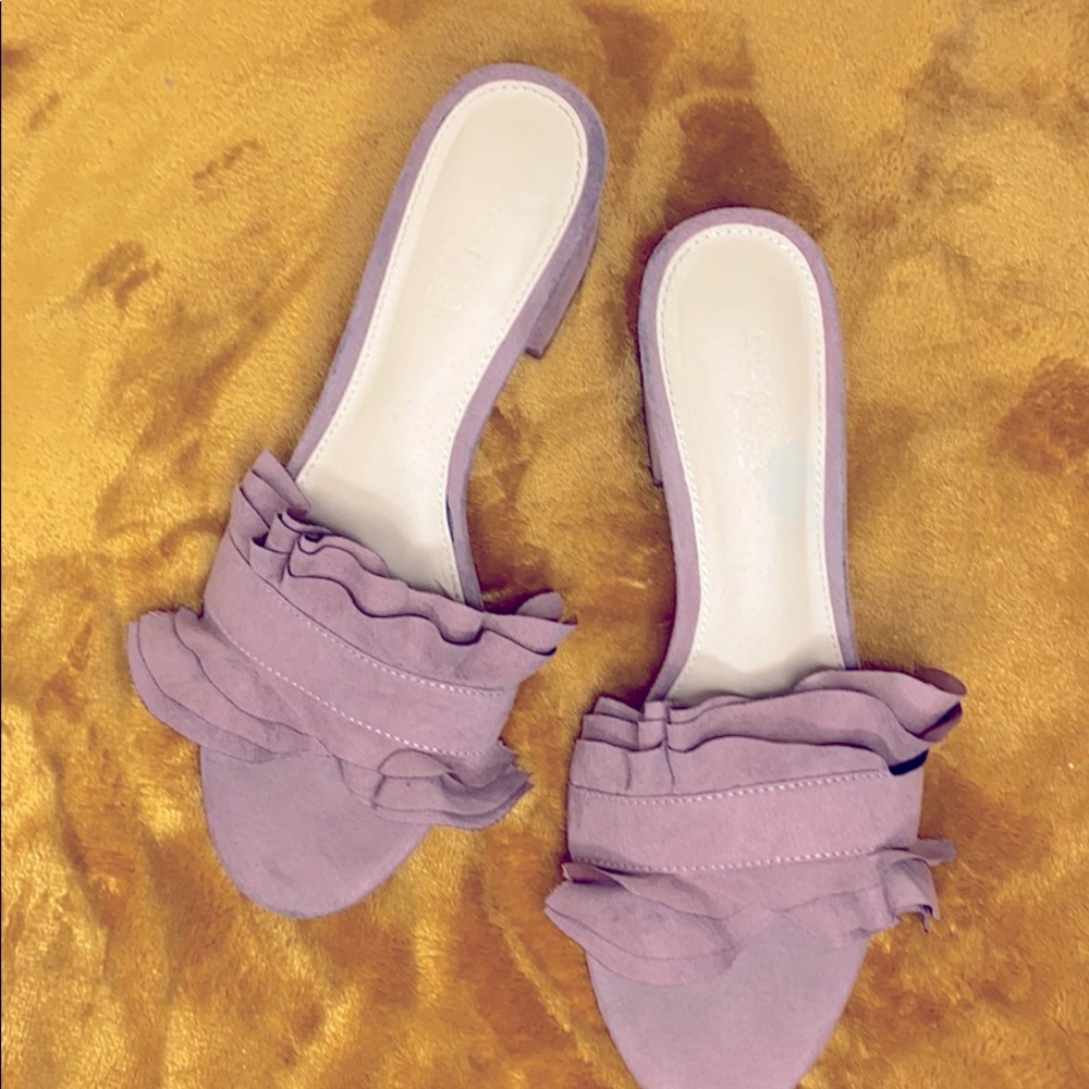 Mauve heeled mules.